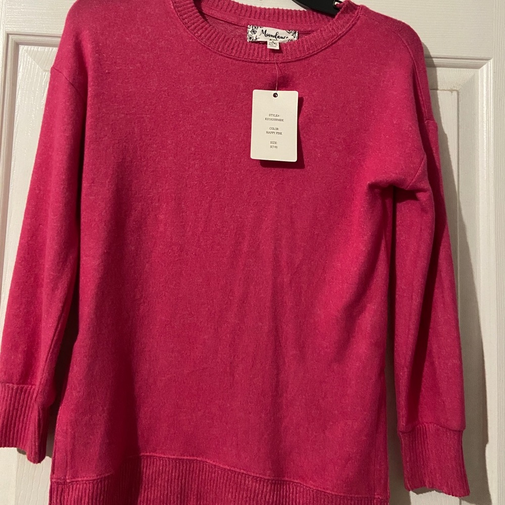 Woman’s pink sweater size Small